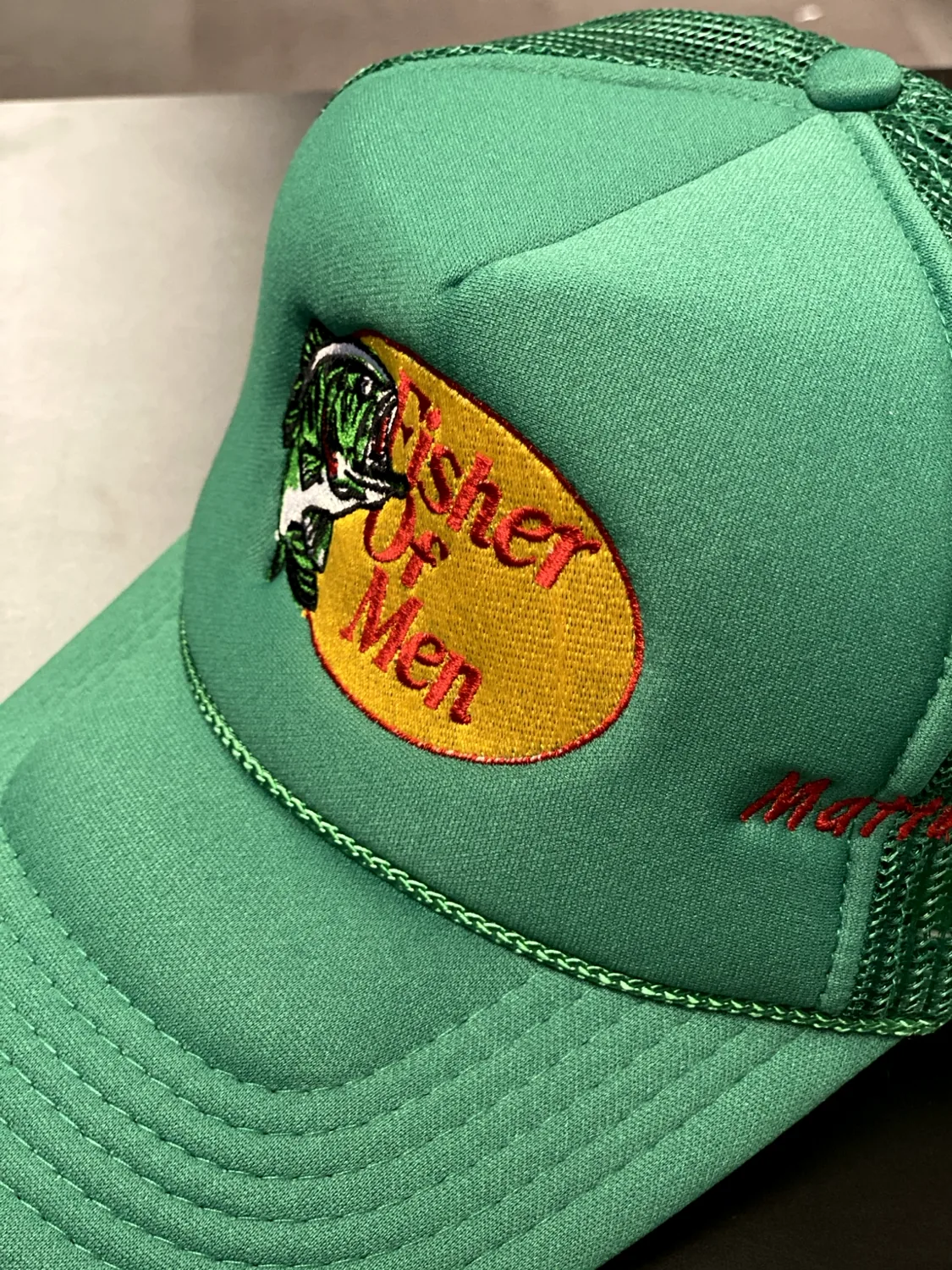 Green embroidered fishing-inspired cap
